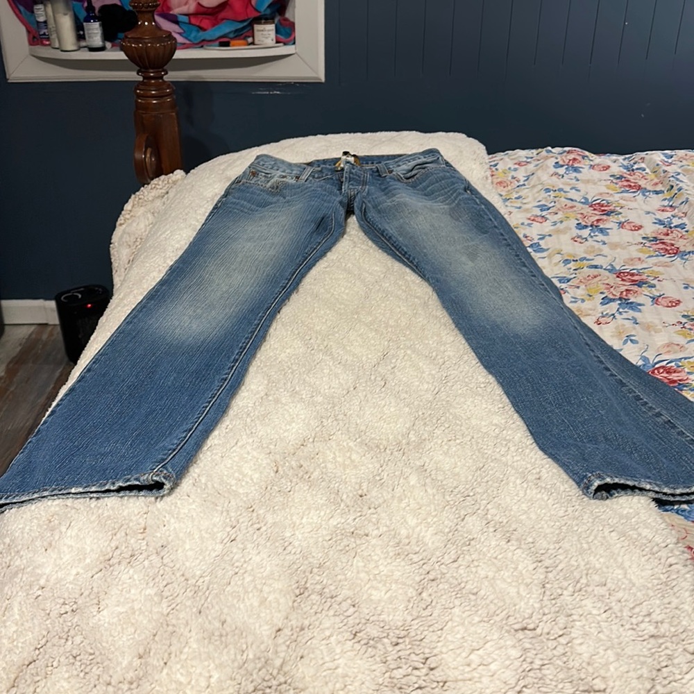 Lucky Jeans waist size 29 light denim wash button fly closure.